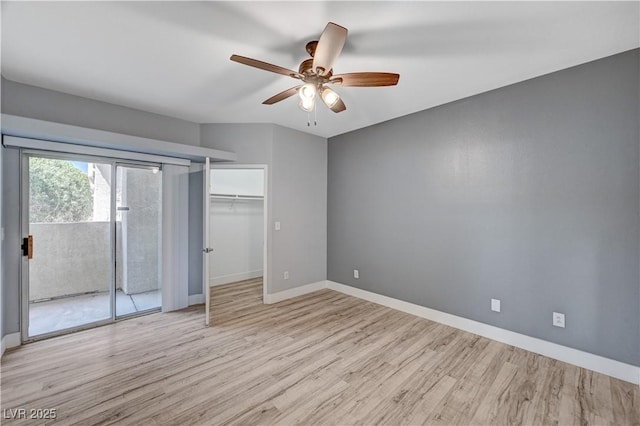 1501 Oscar Ct Unit 101, Las Vegas, NV 89146 - unfurnished bedroom featuring access to outside, wood finished floors, baseboards, and a ceiling fan