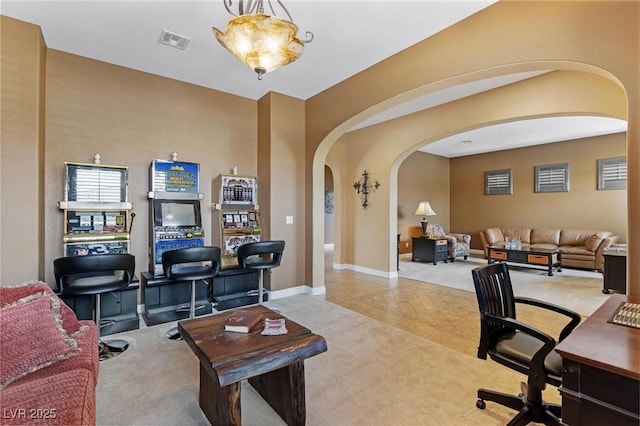 7719 Villa Montara St, Las Vegas, NV 89123 - office area with arched walkways, carpet floors, baseboards, and tile patterned flooring