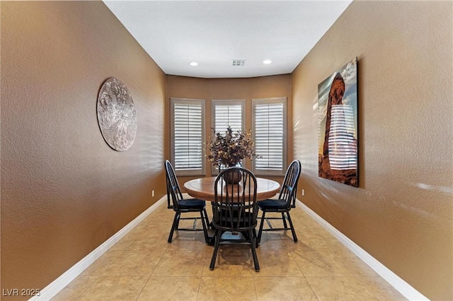 7719 Villa Montara St, Las Vegas, NV 89123 - dining room with baseboards, a textured wall, and light tile patterned floors