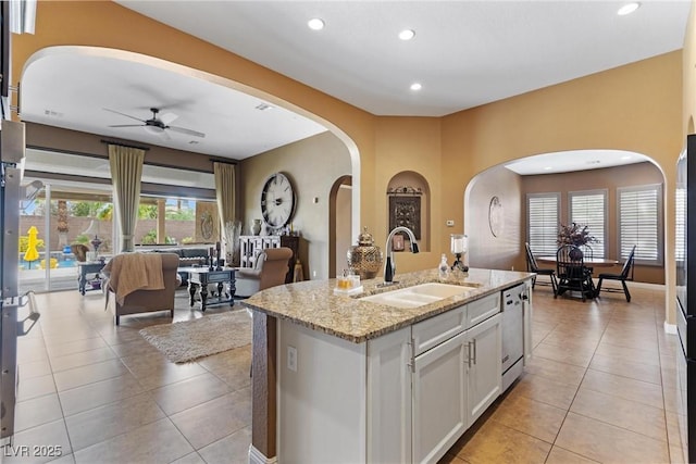 7719 Villa Montara St, Las Vegas, NV 89123 - kitchen with a sink, arched walkways, light tile patterned floors, ceiling fan, and recessed lighting