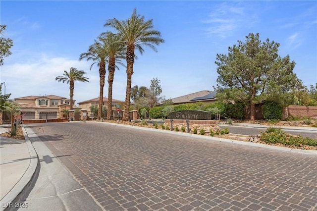 7719 Villa Montara St, Las Vegas, NV 89123 - view of decorative road with curbs, sidewalks, and a gate