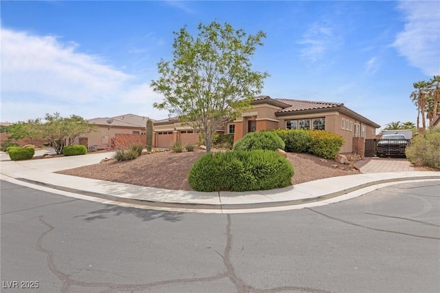 7719 Villa Montara St, Las Vegas, NV 89123 - view of front of home with driveway, stucco siding, an attached garage, a tiled roof, and fence