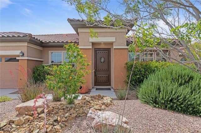 7719 Villa Montara St, Las Vegas, NV 89123 - property entrance featuring stucco siding, a tile roof, and an attached garage