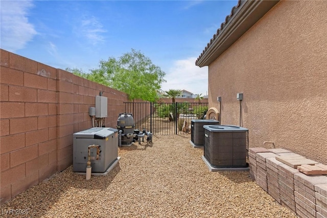 7719 Villa Montara St, Las Vegas, NV 89123 - view of home's exterior featuring stucco siding, central AC unit, and fence