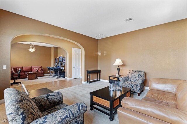 7719 Villa Montara St, Las Vegas, NV 89123 - carpeted living area with arched walkways and baseboards
