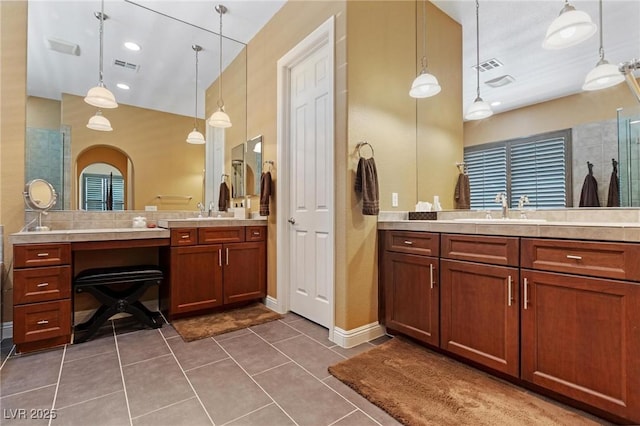7719 Villa Montara St, Las Vegas, NV 89123 - full bathroom with tile patterned floors, two vanities, and baseboards
