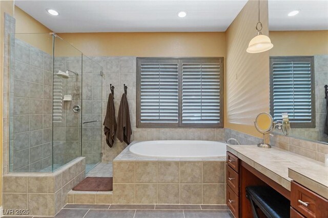 7719 Villa Montara St, Las Vegas, NV 89123 - full bath featuring tiled shower, vanity, a bath, recessed lighting, and tile patterned flooring