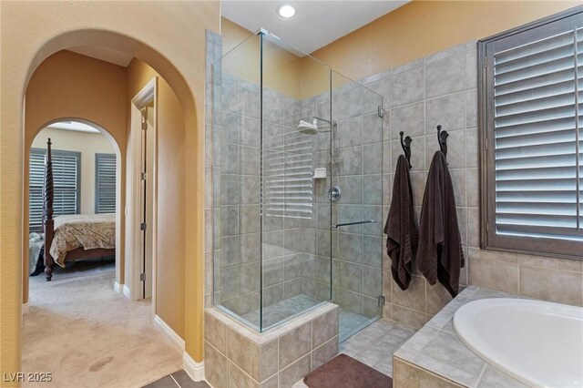 7719 Villa Montara St, Las Vegas, NV 89123 - bathroom with a bath, a tile shower, ensuite bathroom, recessed lighting, and baseboards
