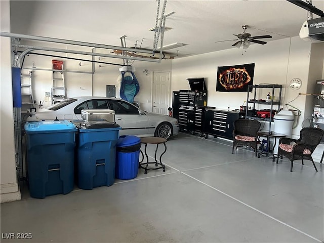7719 Villa Montara St, Las Vegas, NV 89123 - garage with a ceiling fan, a garage door opener, and electric panel