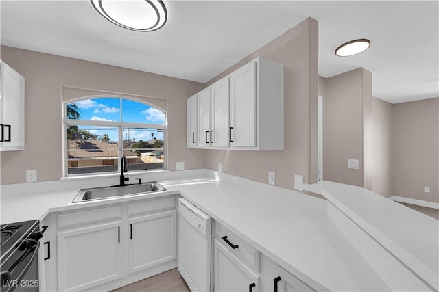 4324 W Lake Mead Blvd Unit 202, Las Vegas, NV 89108 - kitchen featuring dishwasher, black gas range oven, white cabinets, and light countertops
