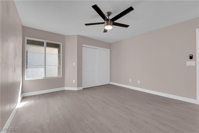 4324 W Lake Mead Blvd Unit 202, Las Vegas, NV 89108 - unfurnished bedroom with wood finished floors, baseboards, a ceiling fan, and a closet