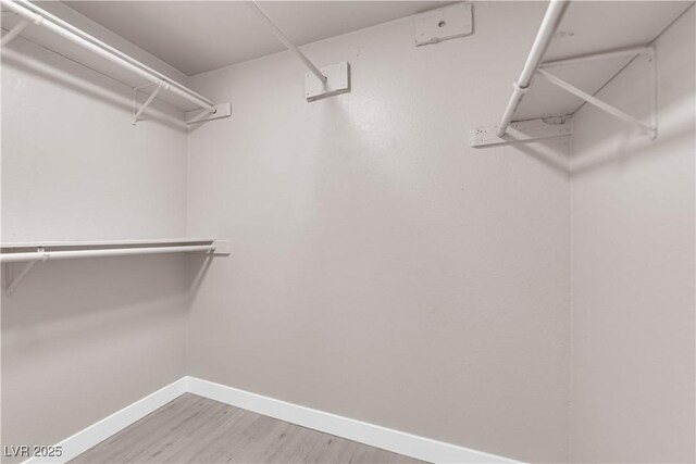 4324 W Lake Mead Blvd Unit 202, Las Vegas, NV 89108 - walk in closet featuring wood finished floors