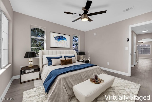 4324 W Lake Mead Blvd Unit 202, Las Vegas, NV 89108 - bedroom with wood finished floors, multiple windows, and ceiling fan