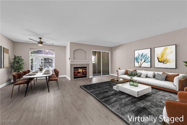 4324 W Lake Mead Blvd Unit 202, Las Vegas, NV 89108 - living room featuring wood finished floors, a ceiling fan, and a fireplace