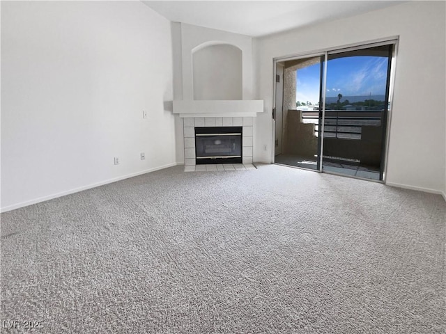 living area with a fireplace, carpet floors, and baseboards