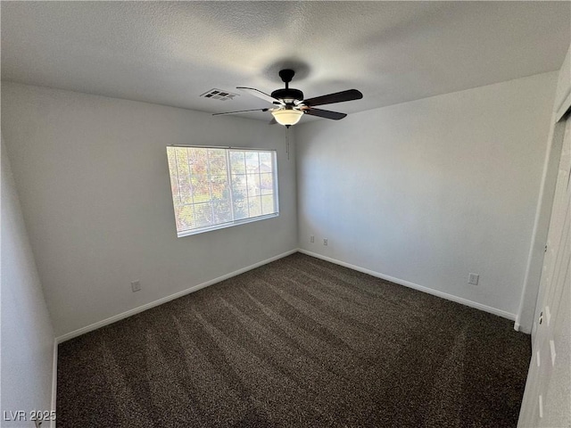 10574 Salmon Leap St, Las Vegas, NV 89183 - spare room with ceiling fan, dark colored carpet, baseboards, and a textured ceiling