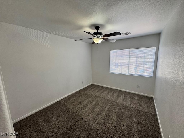 10574 Salmon Leap St, Las Vegas, NV 89183 - spare room featuring dark carpet, ceiling fan, baseboards, and a textured ceiling