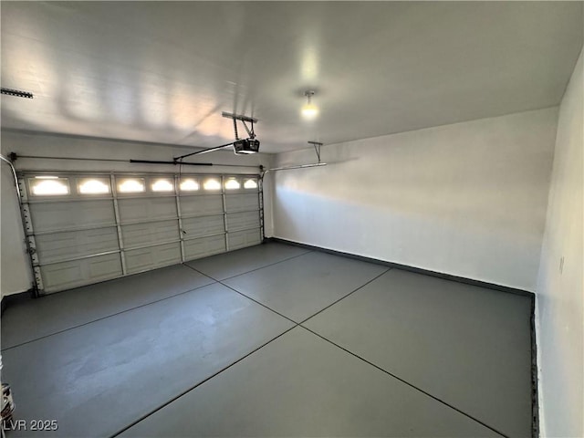 10574 Salmon Leap St, Las Vegas, NV 89183 - garage with a garage door opener and baseboards