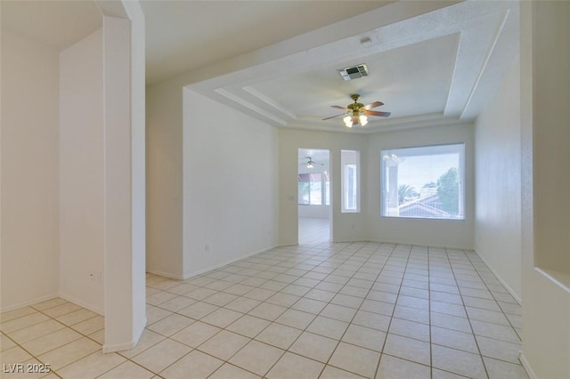 494 Dart Brook Pl, Henderson, NV 89012 - unfurnished room with a raised ceiling, ceiling fan, light tile patterned floors, and baseboards