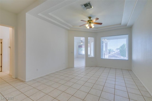 494 Dart Brook Pl, Henderson, NV 89012 - spare room featuring a raised ceiling, ceiling fan, light tile patterned flooring, and baseboards