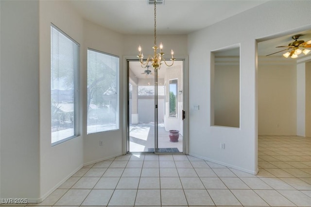 494 Dart Brook Pl, Henderson, NV 89012 - unfurnished dining area featuring a chandelier, light tile patterned floors, ceiling fan, and baseboards