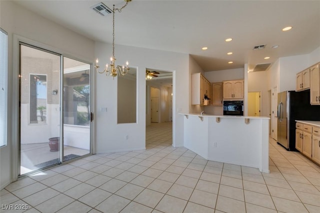 494 Dart Brook Pl, Henderson, NV 89012 - kitchen featuring black oven, stainless steel refrigerator with ice dispenser, light brown cabinets, light countertops, and a peninsula