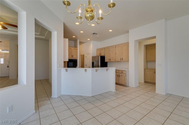 494 Dart Brook Pl, Henderson, NV 89012 - kitchen with stainless steel refrigerator with ice dispenser, oven, light brown cabinets, a peninsula, and a chandelier
