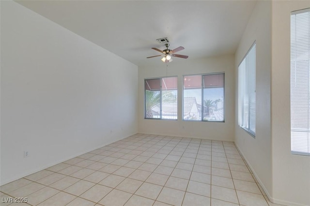 494 Dart Brook Pl, Henderson, NV 89012 - empty room featuring ceiling fan, healthy amount of natural light, and light tile patterned floors