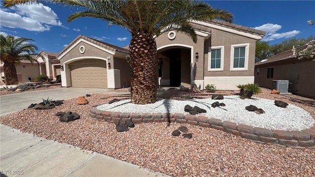 494 Dart Brook Pl, Henderson, NV 89012 - view of front of house featuring concrete driveway, a garage, stucco siding, and central AC