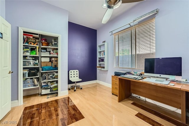 10310 Songsparrow Ct, Las Vegas, NV 89135 - office area with wood finished floors, ceiling fan, and baseboards