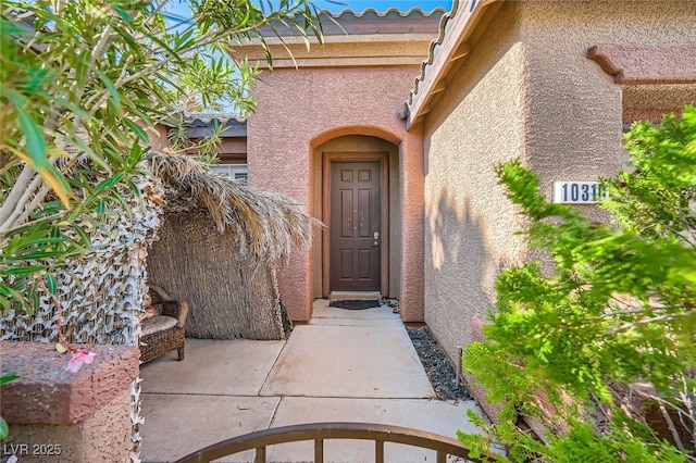 10310 Songsparrow Ct, Las Vegas, NV 89135 - entrance to property featuring stucco siding and a tile roof