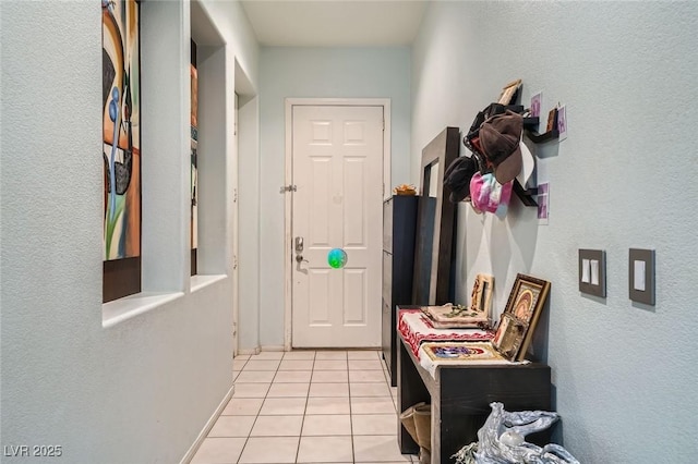 10310 Songsparrow Ct, Las Vegas, NV 89135 - corridor with light tile patterned floors and a textured wall