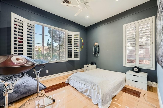 10310 Songsparrow Ct, Las Vegas, NV 89135 - bedroom with wood finished floors, baseboards, ceiling fan, and recessed lighting