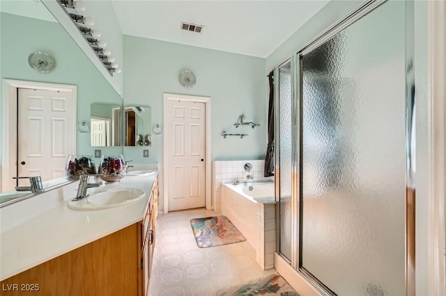 10310 Songsparrow Ct, Las Vegas, NV 89135 - full bathroom featuring a stall shower, a bath, and double vanity