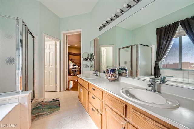 10310 Songsparrow Ct, Las Vegas, NV 89135 - bathroom featuring a stall shower, double vanity, and tile patterned floors