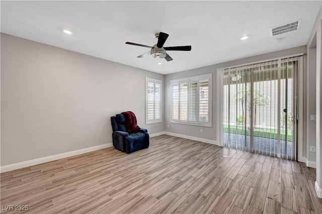 unfurnished room with light wood-type flooring, baseboards, ceiling fan, and recessed lighting