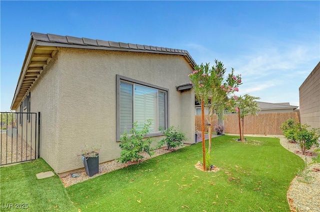 view of side of home featuring stucco siding