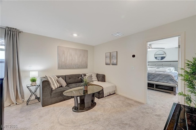living room with carpet flooring and baseboards