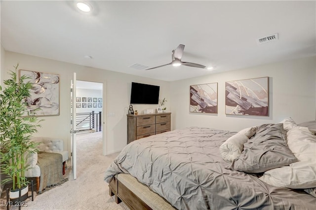 bedroom featuring light carpet, a ceiling fan, and recessed lighting