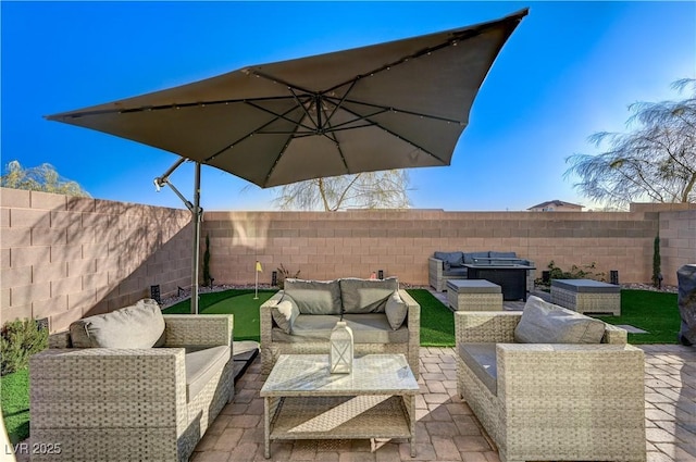 view of patio with outdoor lounge area and a fenced backyard