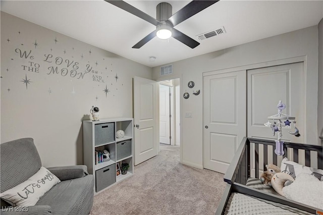 carpeted bedroom featuring a closet, ceiling fan, and baseboards