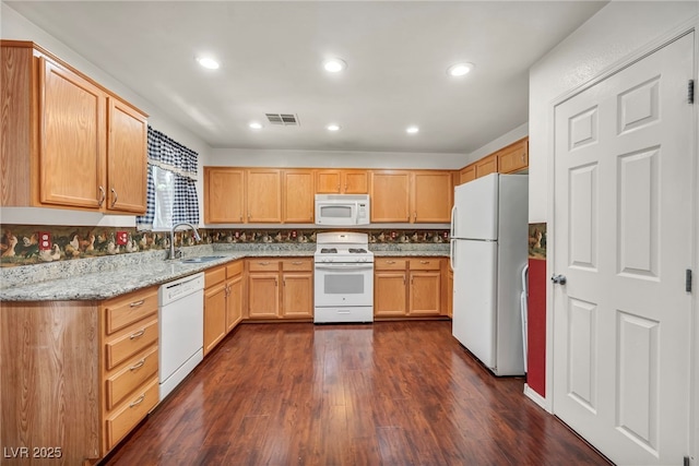 9165 Starling Wing Pl, Las Vegas, NV 89143 - kitchen with white appliances, a sink, dark wood-type flooring, light stone countertops, and recessed lighting