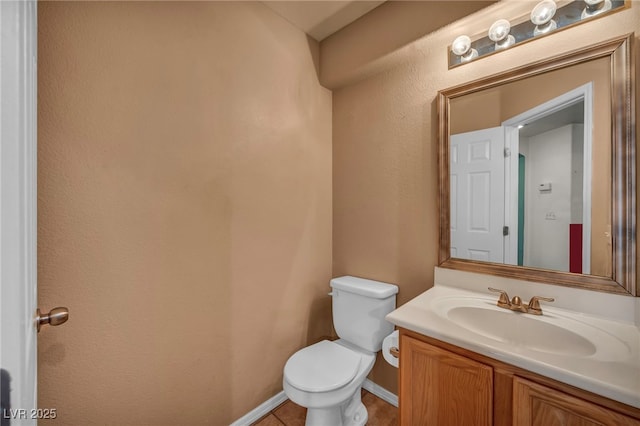 9165 Starling Wing Pl, Las Vegas, NV 89143 - bathroom featuring toilet, vanity, and baseboards