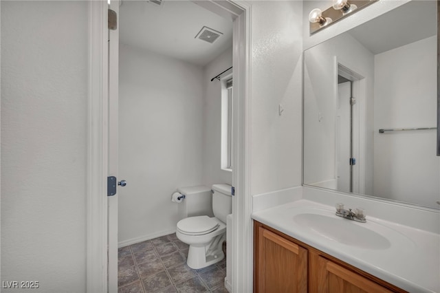 9165 Starling Wing Pl, Las Vegas, NV 89143 - bathroom with toilet, vanity, and baseboards