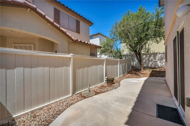 9165 Starling Wing Pl, Las Vegas, NV 89143 - fenced backyard with a patio