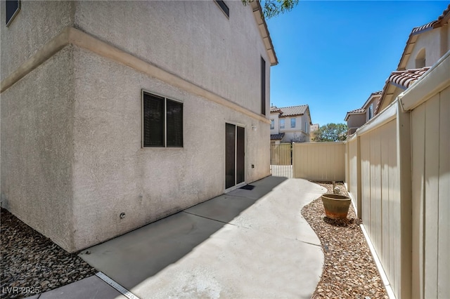 9165 Starling Wing Pl, Las Vegas, NV 89143 - fenced backyard with a patio