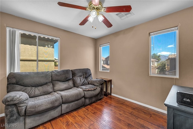 9165 Starling Wing Pl, Las Vegas, NV 89143 - living room with ceiling fan, wood-type flooring, baseboards, and healthy amount of natural light