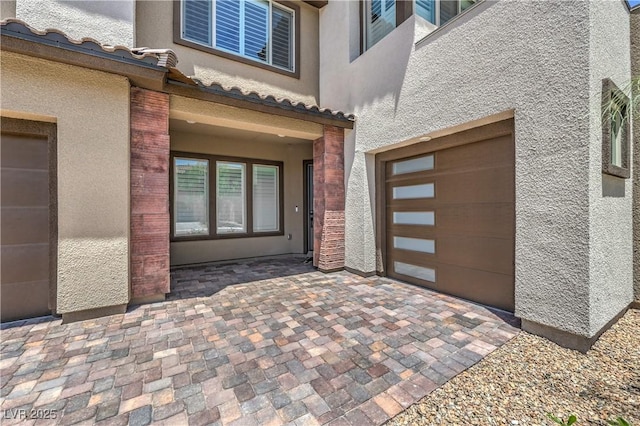 201 Carmel Sky St, Las Vegas, NV 89138 - property entrance with stucco siding and an attached garage