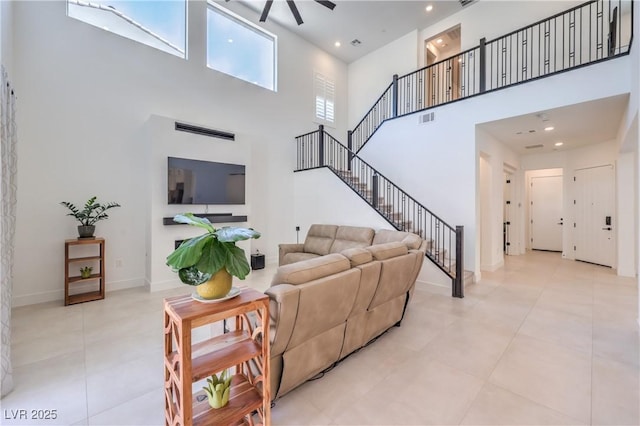 201 Carmel Sky St, Las Vegas, NV 89138 - living area featuring a high ceiling, a ceiling fan, stairway, tile patterned flooring, and recessed lighting