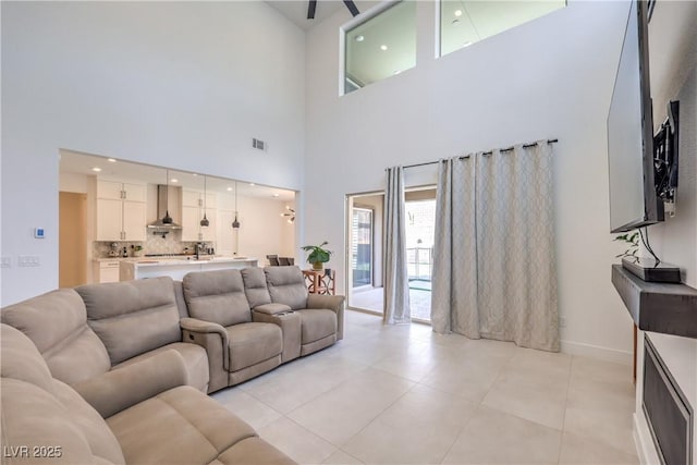 201 Carmel Sky St, Las Vegas, NV 89138 - living area with a high ceiling and light tile patterned floors